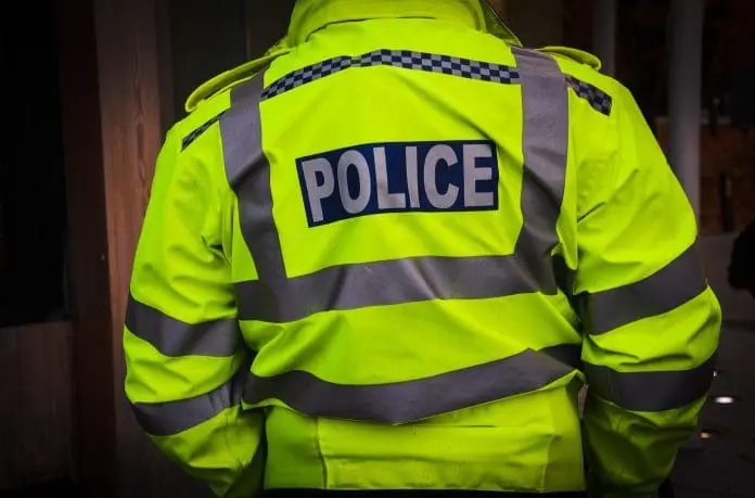 A,Police,Officer,In,A,Yellow,Uniform
