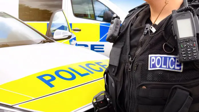 Police,Officer,And,Police,Car,-,Scene,Of,Emergency,Services'