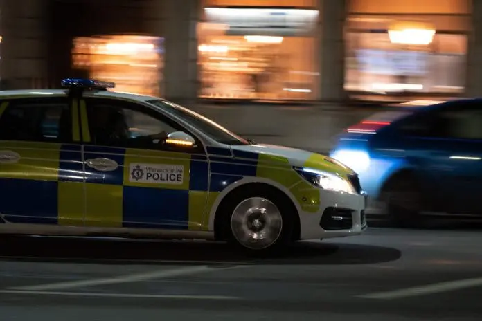 Speeding,Police,Car,At,Night,Uk