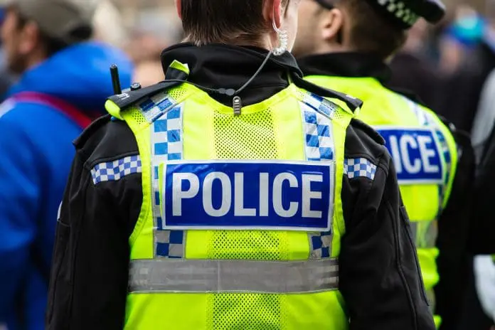 crime-3-police-officers-in-yellow-vests
