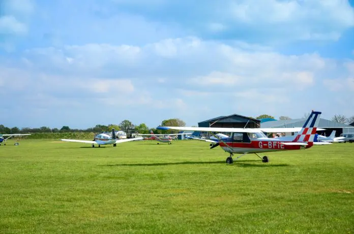 Propeller planes at an airfield in summer