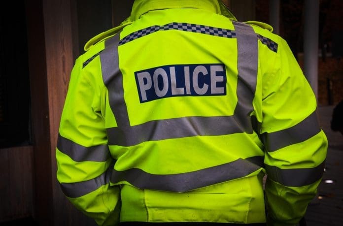 A,Police,Officer,In,A,Yellow,Uniform